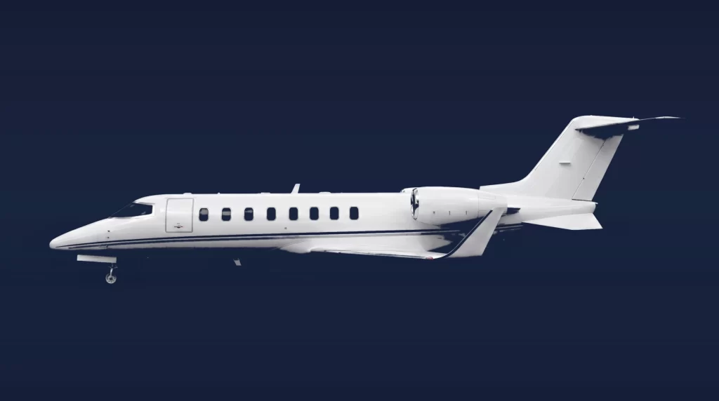 Bombardier Learjet 45XR private charter aircraft, left-side profile on a deep navy studio background