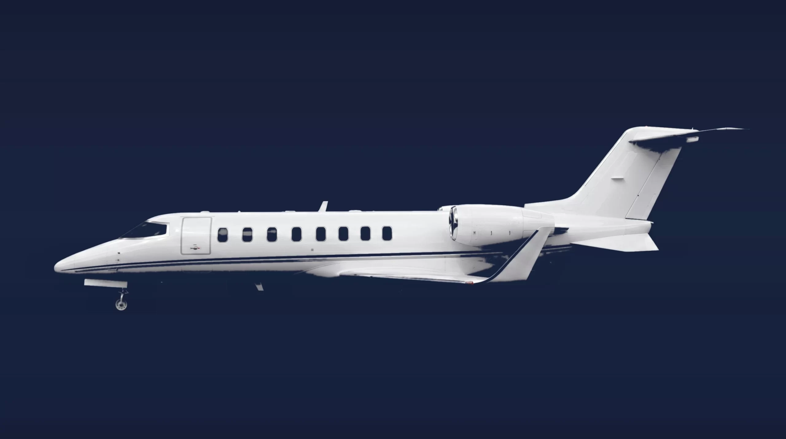 Bombardier Learjet 45XR private charter aircraft, left-side profile on a deep navy studio background