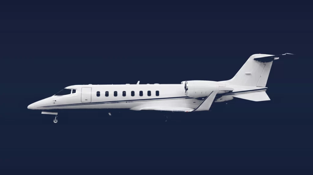Bombardier Learjet 60XR private charter aircraft, left-side profile on a deep navy studio background