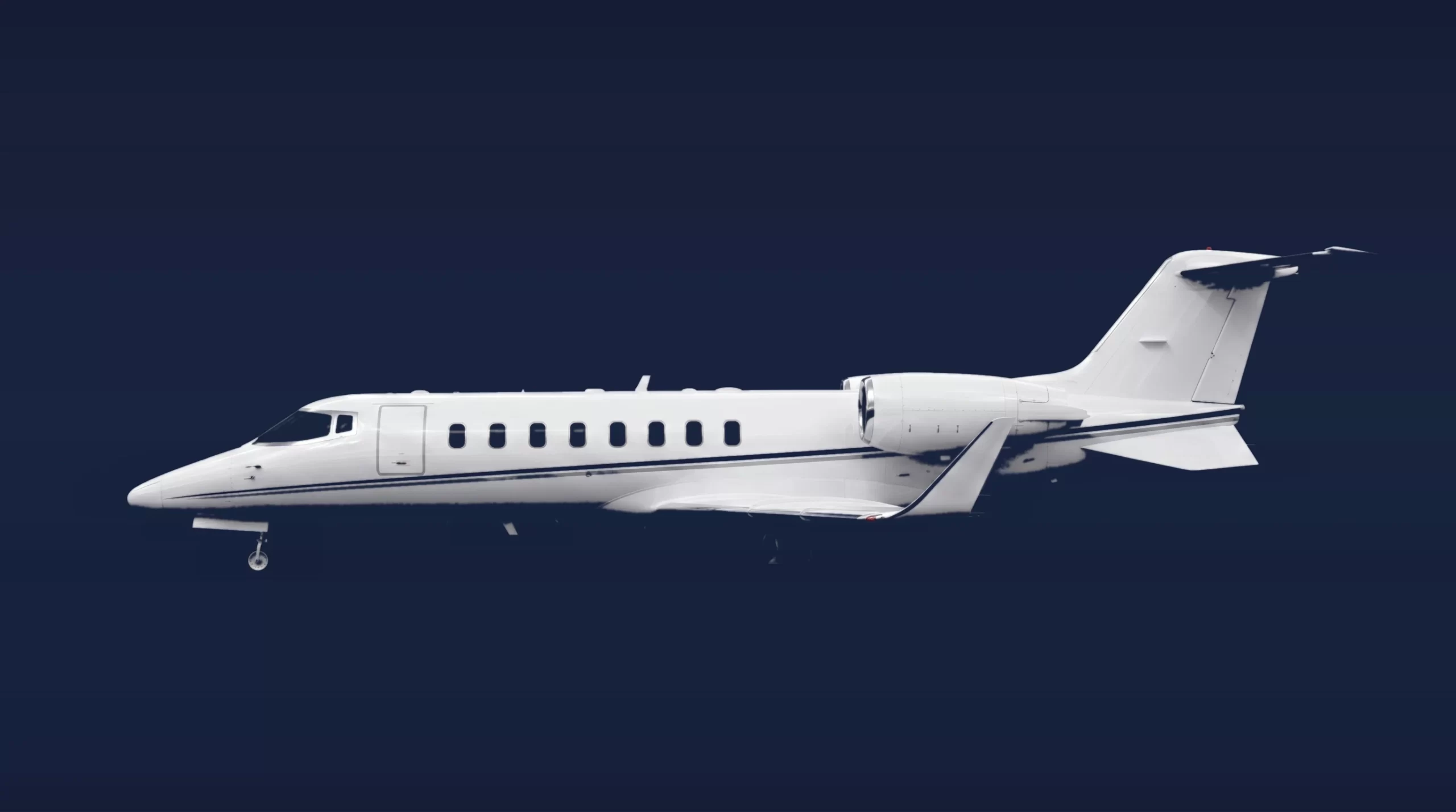 Bombardier Learjet 60XR private charter aircraft, left-side profile on a deep navy studio background