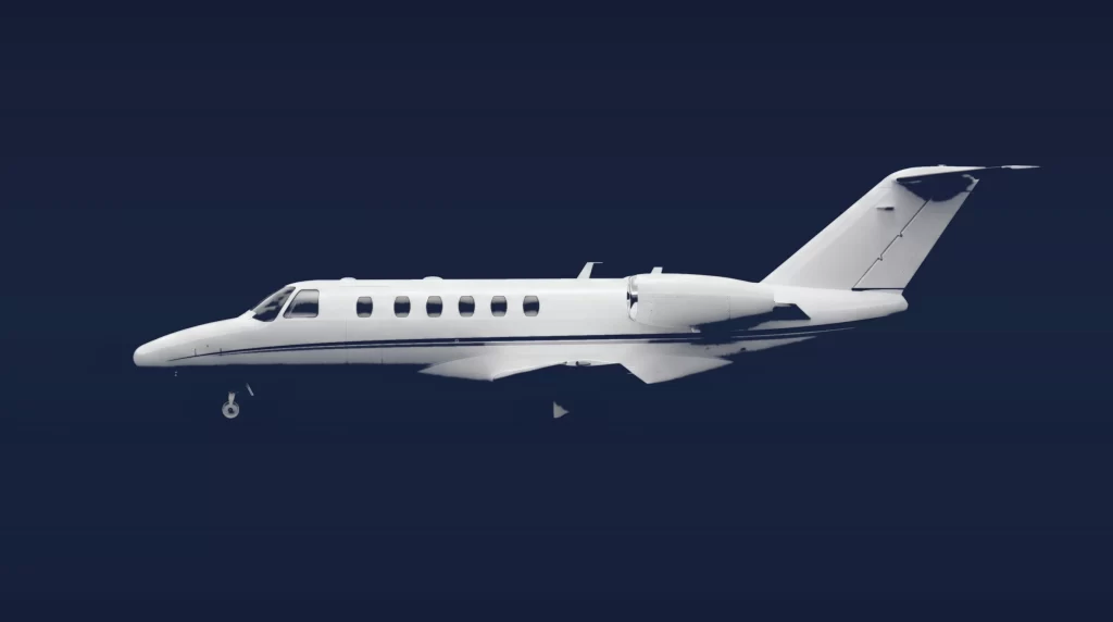 Cessna Citation CJ2+ private charter aircraft, left-side profile on a deep navy studio background