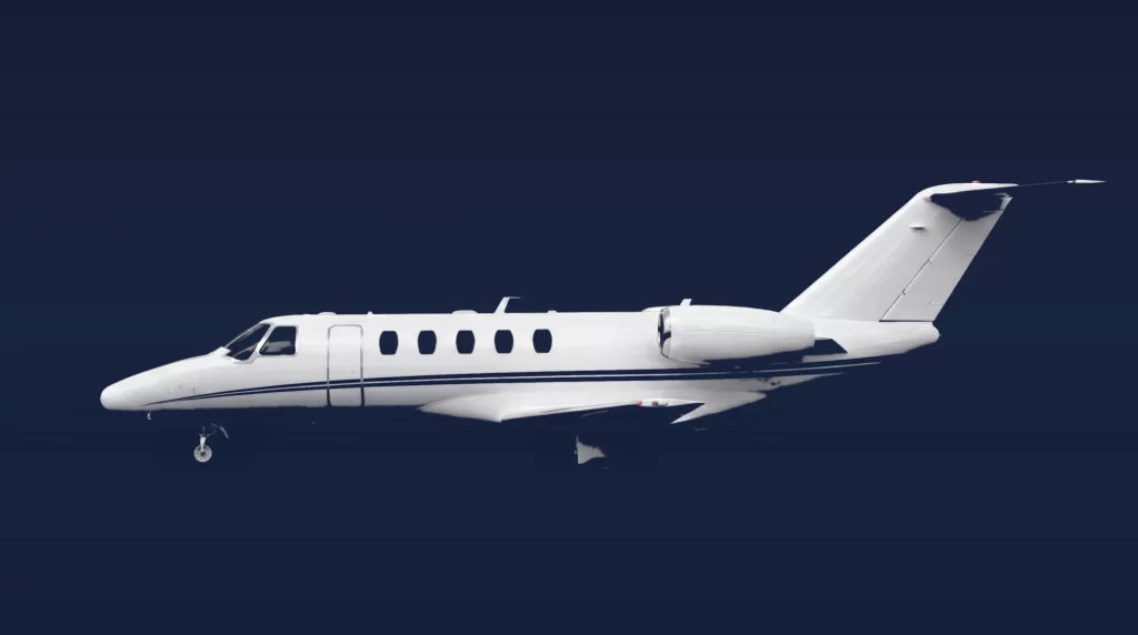 Cessna Citation CJ3 private charter aircraft, left-side profile on a deep navy studio background