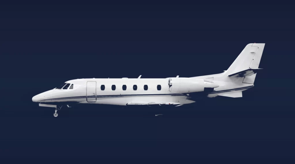 Cessna Citation XLS+ private charter aircraft, left-side profile on a deep navy studio background