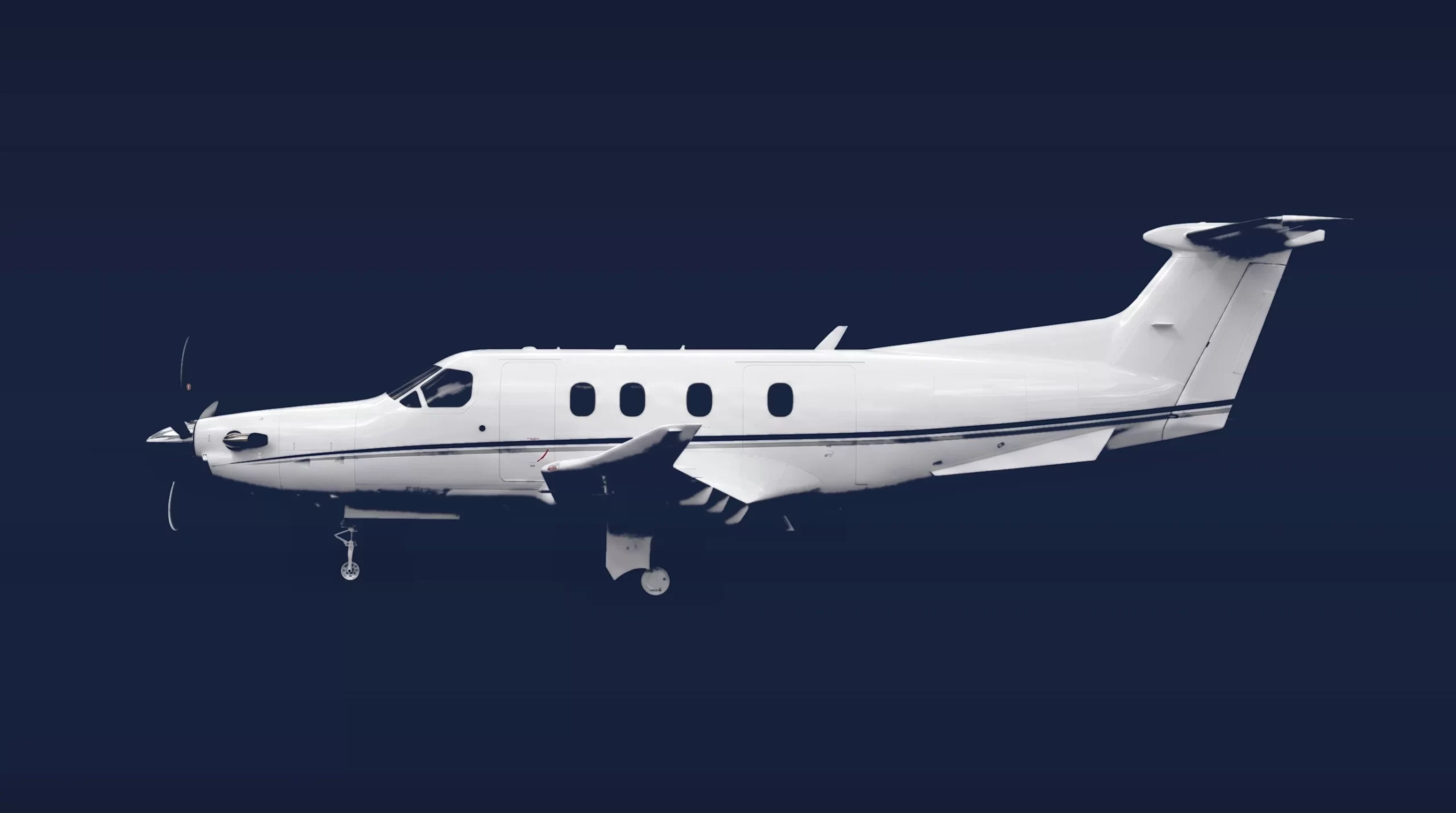 Pilatus PC-12 NGX private charter aircraft, left-side profile on a deep navy studio background