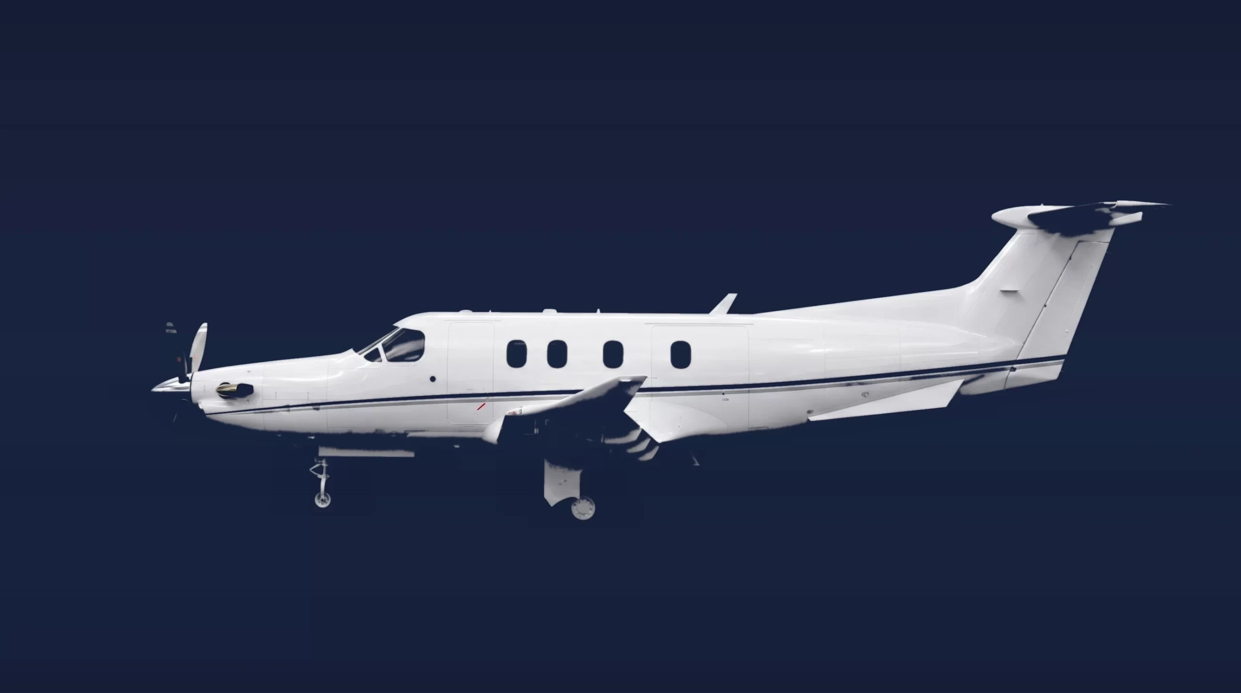 Pilatus PC-12 PRO private charter aircraft, left-side profile on a deep navy studio background
